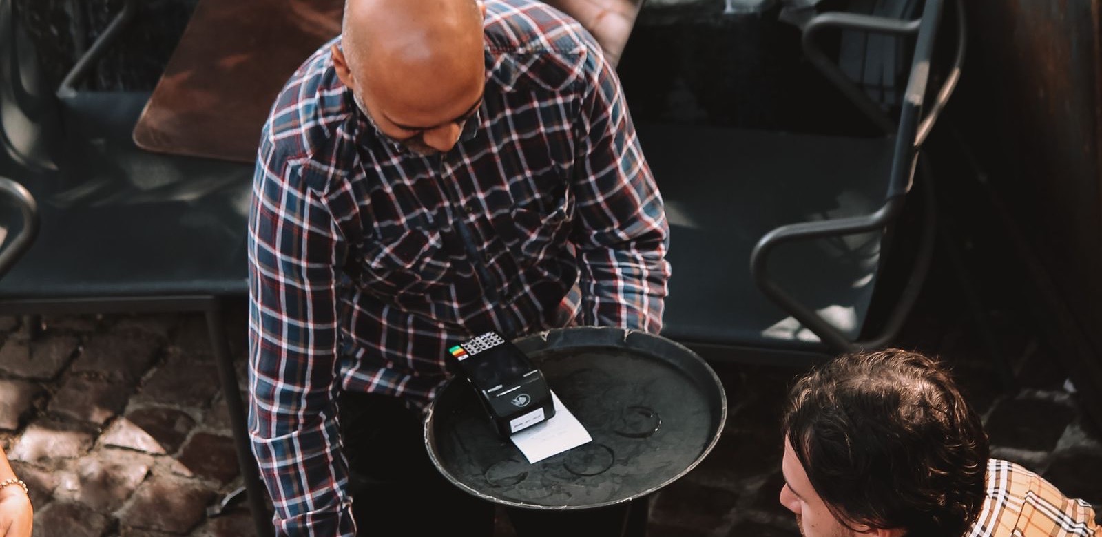 Staff in casual street clothes serving at a venue