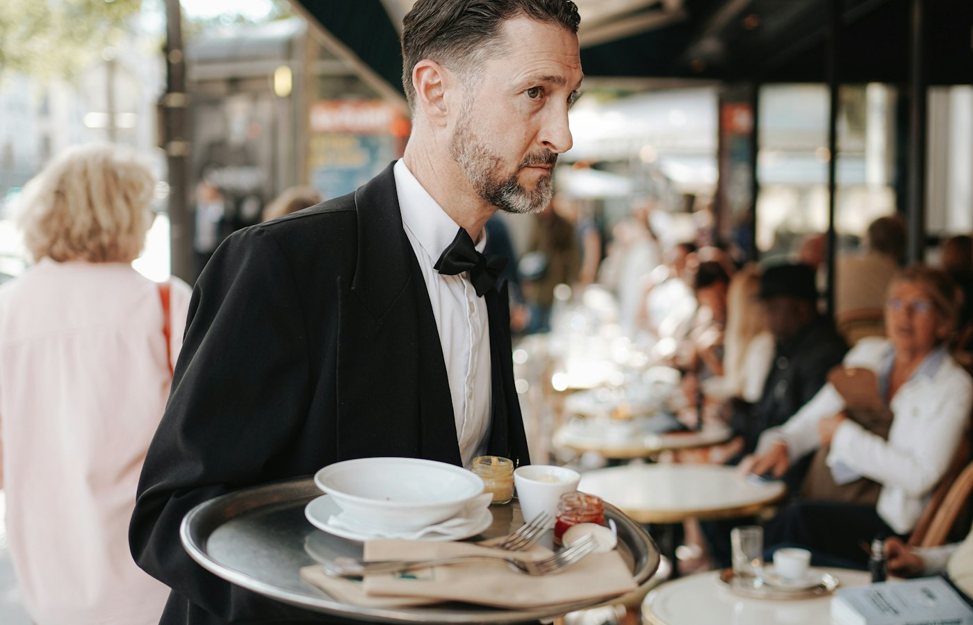 Hospitality waiter serving guests