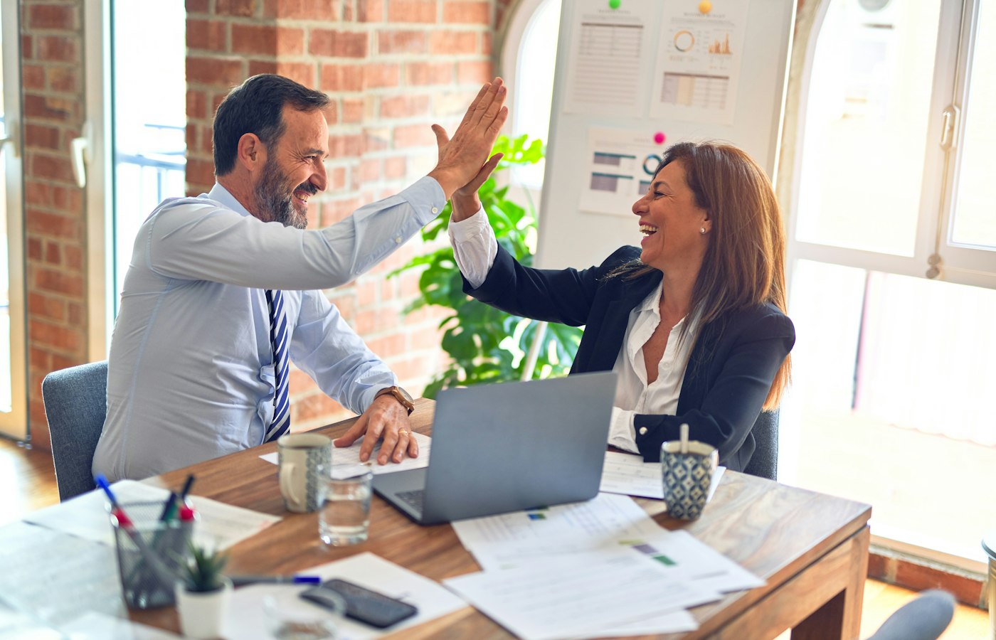 Employer giving a compliment for good work